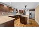 Spacious kitchen featuring stainless steel appliances, granite countertops, and a center island at 4608 Rosemear Ct, Norcross, GA 30093