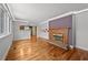 Bright living room featuring a fireplace, hardwood floors, and an open layout at 4608 Rosemear Ct, Norcross, GA 30093