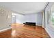 Spacious living room featuring hardwood floors, neutral paint, and an open layout at 4608 Rosemear Ct, Norcross, GA 30093