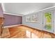 Bright living room with hardwood floors, large windows, and a cozy fireplace at 4608 Rosemear Ct, Norcross, GA 30093