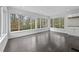 Sunroom with hardwood floors and many windows allowing ample natural light at 4608 Rosemear Ct, Norcross, GA 30093