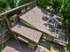 Aerial view of the roof with multiple skylights, large deck, and surrounding lush trees at 605 Ga 120 Hwy, Roswell, GA 30075