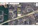 Aerial view showcases the property's location and land with an approximate size of +/- 3.7 acres at 605 Ga 120 Hwy, Roswell, GA 30075
