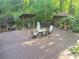 Spacious back deck features multiple seating areas, grill, and wooded views perfect for outdoor entertaining at 605 Ga 120 Hwy, Roswell, GA 30075