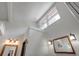 Bright bathroom features a large mirror, sconce lighting and a skylight for natural light at 605 Ga 120 Hwy, Roswell, GA 30075