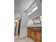 This bathroom features granite counters, a walk-in shower, and a bright window at 605 Ga 120 Hwy, Roswell, GA 30075