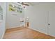 Bright bedroom with hardwood floors, double doors, and a large window providing ample natural light at 605 Ga 120 Hwy, Roswell, GA 30075