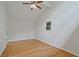 Bright bedroom with hardwood floors, white walls and vaulted ceiling at 605 Ga 120 Hwy, Roswell, GA 30075