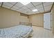 Cozy bedroom with tile floors and a drop ceiling, offering a simple and comfortable living space at 605 Ga 120 Hwy, Roswell, GA 30075