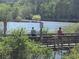View of a bridge over water, offering a serene spot for visitors to enjoy the scenery at 605 Ga 120 Hwy, Roswell, GA 30075