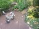 Expansive wooden deck featuring an outdoor table with an outdoor shed in a lush setting at 605 Ga 120 Hwy, Roswell, GA 30075