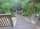Multi-level deck leading to gazebo surrounded by lush plantings at 605 Ga 120 Hwy, Roswell, GA 30075