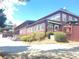 Exterior angle featuring multiple windows and outdoor deck space on a historic building with on-site parking at 605 Ga 120 Hwy, Roswell, GA 30075