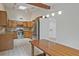 Traditional kitchen features stainless steel appliances and ample counter space with adjacent open floorplan at 605 Ga 120 Hwy, Roswell, GA 30075
