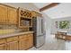 Efficient kitchen features stainless appliances, a pantry, and custom cabinetry for storage and convenience at 605 Ga 120 Hwy, Roswell, GA 30075