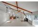 Spacious open living room boasting exposed beams, fireplace, and bar area at 605 Ga 120 Hwy, Roswell, GA 30075