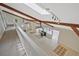 Upstairs view of living room featuring skylights, exposed beams, and fireplace at 605 Ga 120 Hwy, Roswell, GA 30075