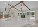 Spacious living room features high ceilings, wood beams, and an inviting fireplace at 605 Ga 120 Hwy, Roswell, GA 30075