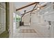 Bright living area with vaulted ceilings, skylights, and wood burning stove with tiled floor at 605 Ga 120 Hwy, Roswell, GA 30075