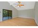 Bright airy main bedroom has vaulted ceiling, access to a private screened in porch and a ceiling fan at 605 Ga 120 Hwy, Roswell, GA 30075