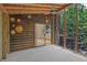 Sunroom with wooden paneling, views of the exterior, and decorated with sun-shaped ornaments at 605 Ga 120 Hwy, Roswell, GA 30075