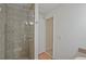 Bright bathroom with glass-enclosed shower stall, stylish tile and fixtures provide a refreshing experience at 605 Ga 120 Hwy, Roswell, GA 30075