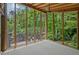 Bright sunroom with wood ceiling and backyard views at 605 Ga 120 Hwy, Roswell, GA 30075