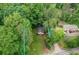 Aerial view of a property surrounded by lush greenery, showcasing its boundaries at 2865 Chattahoochee Rd, Cumming, GA 30041