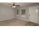 Cozy living room with two windows and carpeted floors, offering a bright and comfortable living space at 2865 Chattahoochee Rd, Cumming, GA 30041