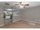Open-concept view of living room with carpeted floors flowing into a kitchen with stainless steel appliances at 2865 Chattahoochee Rd, Cumming, GA 30041