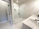 Modern bathroom featuring double sinks, glass shower and tile flooring at 5702 Urban Village Way # 2, Tucker, GA 30084