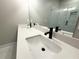 Bathroom featuring double sinks, a large mirror, and glass shower at 5702 Urban Village Way # 2, Tucker, GA 30084
