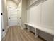 Functional mudroom featuring built-in bench seating, storage, and modern finishes at 5702 Urban Village Way # 2, Tucker, GA 30084