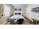 Cozy bedroom with natural light, featuring hardwood floors, neutral paint, and stylish decor, a private retreat at 6645 Cortland Walk, Alpharetta, GA 30005