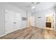 Bright bedroom featuring hardwood floors, double door closet, and neutral paint, creating a serene atmosphere at 6645 Cortland Walk, Alpharetta, GA 30005