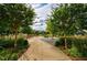 Enjoy the serenity of a beautifully landscaped green space, perfect for community gatherings and relaxation at 6645 Cortland Walk, Alpharetta, GA 30005