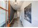 Inviting entryway with wood floors, a stylish light fixture, and a view of the staircase at 6645 Cortland Walk, Alpharetta, GA 30005
