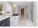 Bright bathroom features a soaking tub, walk-in shower, double vanity, and a spacious walk-in closet at 2720 Garonne Way, Cumming, GA 30041