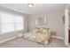 Neutral bedroom with window and bed at 2720 Garonne Way, Cumming, GA 30041