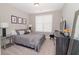 Bedroom with neutral colors, dresser and lamps at 2720 Garonne Way, Cumming, GA 30041