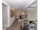 Hallway with wood floors, railing, and artwork at 2720 Garonne Way, Cumming, GA 30041