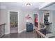 Second floor hallway featuring dark wood floors and natural lighting at 2720 Garonne Way, Cumming, GA 30041