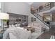 Spacious living room with a fireplace, soaring ceilings, and an open floor plan at 2720 Garonne Way, Cumming, GA 30041