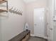 Mudroom features a rustic bench with coat hooks and decor at 2720 Garonne Way, Cumming, GA 30041