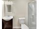 Bathroom featuring modern vanity, toilet, and walk-in shower with glass door at 2880 Field Spring Dr, Lithonia, GA 30058