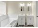 This bathroom offers a double sink vanity and separate tub at 2880 Field Spring Dr, Lithonia, GA 30058
