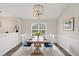 Formal dining room featuring wood table, seating for six, and chandelier at 2880 Field Spring Dr, Lithonia, GA 30058
