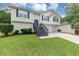 Charming split-level home with inviting entrance, two-car garage and manicured lawn at 2880 Field Spring Dr, Lithonia, GA 30058