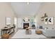 Bright living room with fireplace, vaulted ceiling, and neutral decor at 2880 Field Spring Dr, Lithonia, GA 30058
