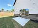 Backyard featuring a concrete patio and a view of a wooded area at 5700 Urban Village Way # 1, Tucker, GA 30084